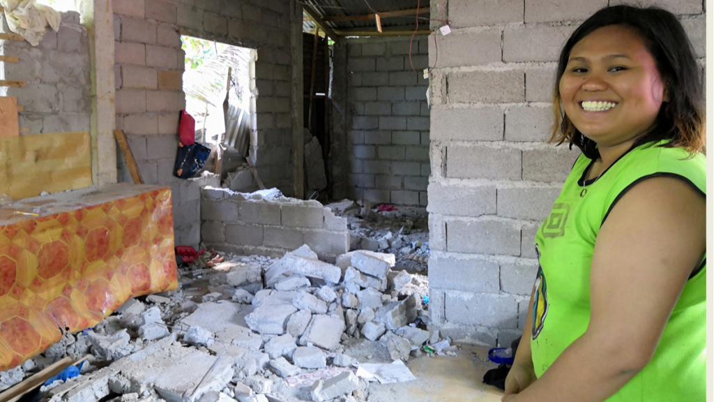 Smiling despite the tragedy: Charmaine's visit to their earthquake-destroyed recently constructed house